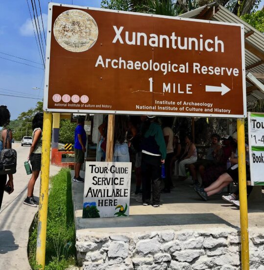 Visitors on a guided tour of the plazas at Xunantunich