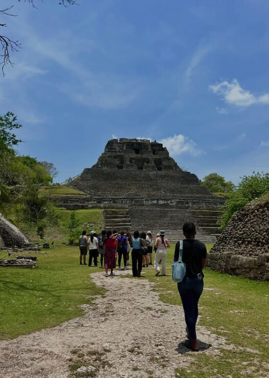 Xunantunich Mayan ruins with visitors on the approach path