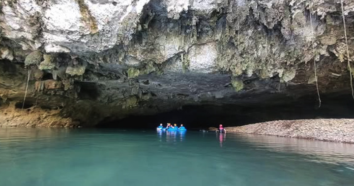 Cave tubing on the underground river at Nohoch Che'en Caves Branch, Belize
